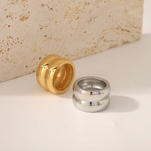Minimalist double-layered 18K gold plated stainless steel wide ring in a lifestyle setting