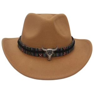Detail of western cowboy hat with ethnic patterned band and metallic bull head ornament