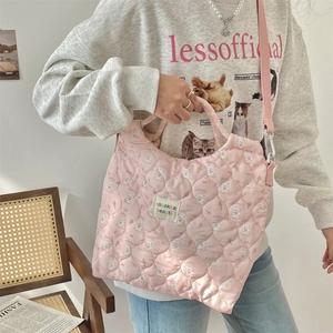 Detail of pink quilted tote with cute bunny print and adjustable shoulder strap