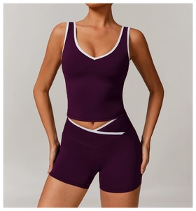 Detailed front view of women's purple yoga set with minimalist white contrast trim
