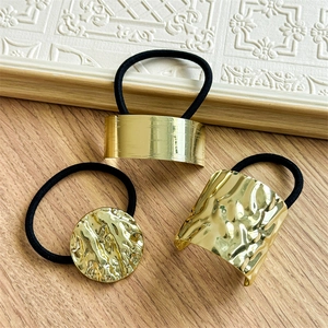 Minimalist irregular gold metal hair ties with brushed and hammered textures