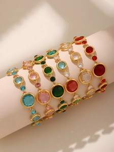 Detailed view of colorful Czech glass stone bracelets on display stands in various colors