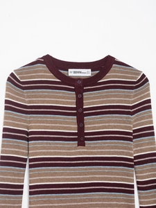 Close-up of multicolor striped knit cardigan showing the soft fabric texture and buttons