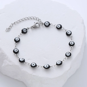 Detail of adjustable evil eye bead bracelet with silver chain and lobster clasp closure