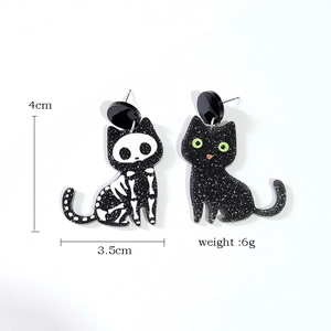 Halloween black cat and skeleton bone earrings with green eyes and 4cm dimensions