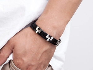 Men's leather bracelet with silver rectangular steel links shown on a model's wrist