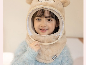 Close-up of kids winter plush hat with integrated neck warmer and clear face shield