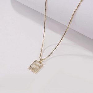 Gold square necklace with mother of pearl inlay and mom lips pendant on white background