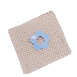 Cute light blue floral hair clip on beige burlap background for girls and women