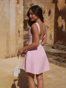 Pink sleeveless backless mini blazer dress for women with a slim fit and flared hemline