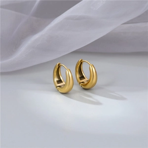 Minimalist chunky golden drop hoop earrings with polished metal finish for women