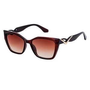 Fashion cat eye sunglasses for women with brown gradient lenses and gold metal V-trim
