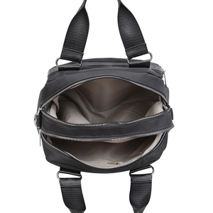 Large capacity black water-resistant nylon crossbody bag with dual main compartments