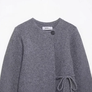 Women's minimalist grey knit cardigan with round neck and drawstring waist detail