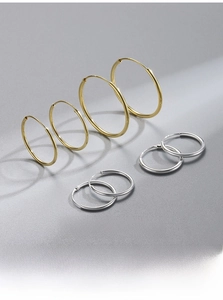 Detail view of S925 silver hoop earrings in various sizes with 18K gold plating