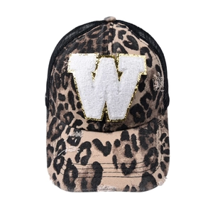 Detail of leopard print baseball cap with white towel embroidered W and gold sequins