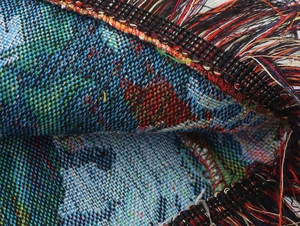 Detailed macro shot of multicolor woven fabric texture with fringe for retro mini dress