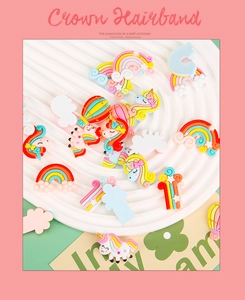 Detailed close-up of colorful resin unicorn and rainbow charms for DIY hair accessories
