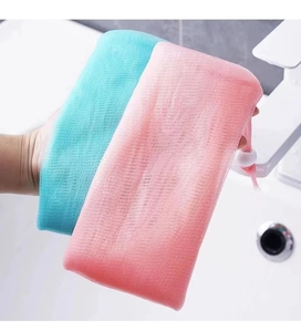 Detail of multi-layered mesh foaming bags in cyan and pink with drawstring closure