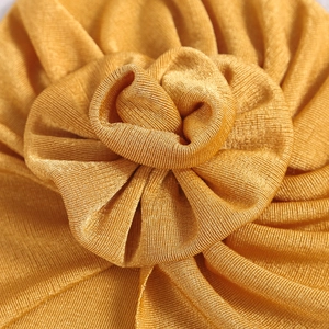 Ginger yellow knitted baby turban hat featuring a 3D handmade rose flower detail
