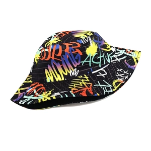 Close-up of street style bucket hat featuring vibrant graffiti prints and active text