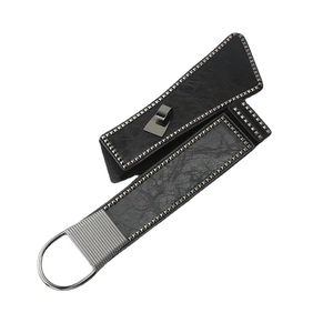 Punk style wide elastic waist belt with silver studs and D-ring on black leather