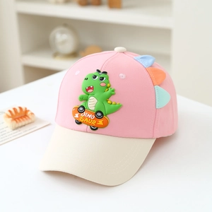 Detail of pink and cream kids baseball cap featuring a 3D rubber dinosaur on a skateboard