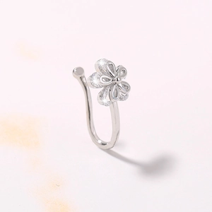 Detail of silver flower nose clip with sparkling zircon stones in a non-piercing design