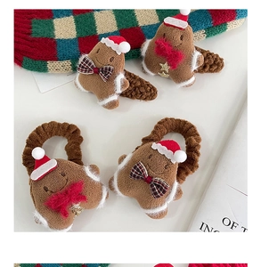 Set of four plush gingerbread man hair ties with festive hats and decorative bows