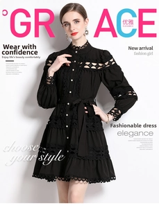 Detail of black lace dress featuring a stand collar with white pearl buttons and hollow out lace