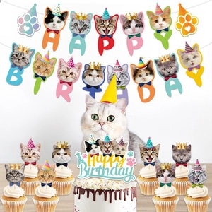 Cartoon cat themed birthday party decorations with banner, cake toppers and cute cat motifs