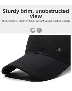 Detail of black baseball cap showing the Z-shaped metal logo and reinforced stitching