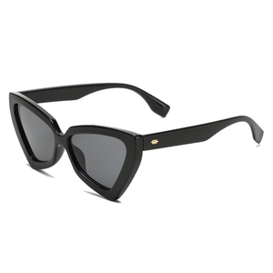 Chic black cat-eye sunglasses with triangular geometric frame and gold metal accents