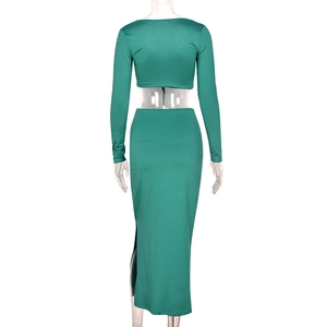 Detailed back view of green two-piece crop top and long maxi skirt with ruching details