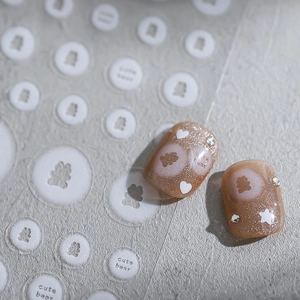 5D nail art stickers with cute white bears, hearts, and stars on coffee glitter nails
