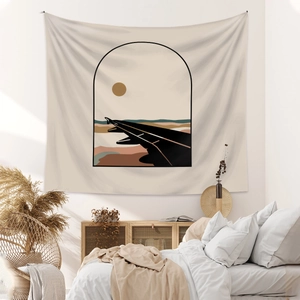 Minimalist aircraft and desert landscape tapestry hanging in a cozy neutral bedroom