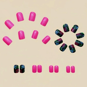 Short square false nails set with pink polish and floral leaf patterns on black base