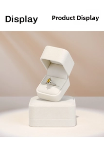Marquise yellow gemstone ring on beige velvet box with elegant micro-paved silver band