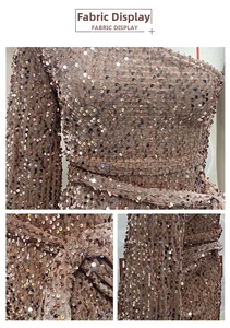 Detail of rose gold sequins on a one-shoulder evening dress with a matching belt
