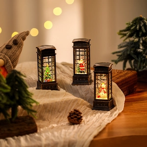 Macro detail of telephone booth Christmas lantern with Santa Claus and festive warm LED lights