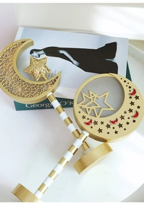 Detailed view of champagne gold moon and star LED wand lamp with festive mesh texture
