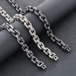 Macro view of vintage hammered texture titanium steel square chains in three metallic finishes