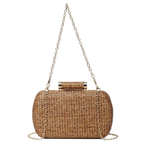 Detail of a gold straw-woven evening clutch bag with metallic chain and cylinder clasp