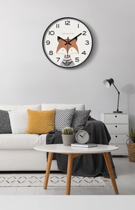 Modern wall clock featuring a cute fox illustration on a minimalist white dial face