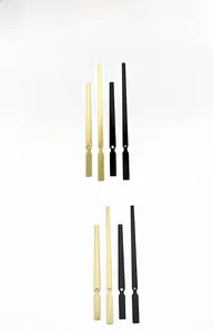 Detail view of gold and black vintage hollow metal clock hands for quartz movements