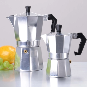Two sizes of classic silver aluminum Moka pots with black handles on a table