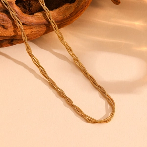 Detailed close-up of a golden multi-strand twisted snake chain with metallic luster