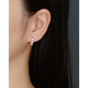 Macro shot of elegant silver flower cluster earrings with sparkling cubic zirconia