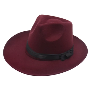 Detail of burgundy fedora hat featuring a black satin ribbon and elegant bow accent