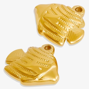Close-up of two golden stainless steel fish pendants for DIY jewelry making